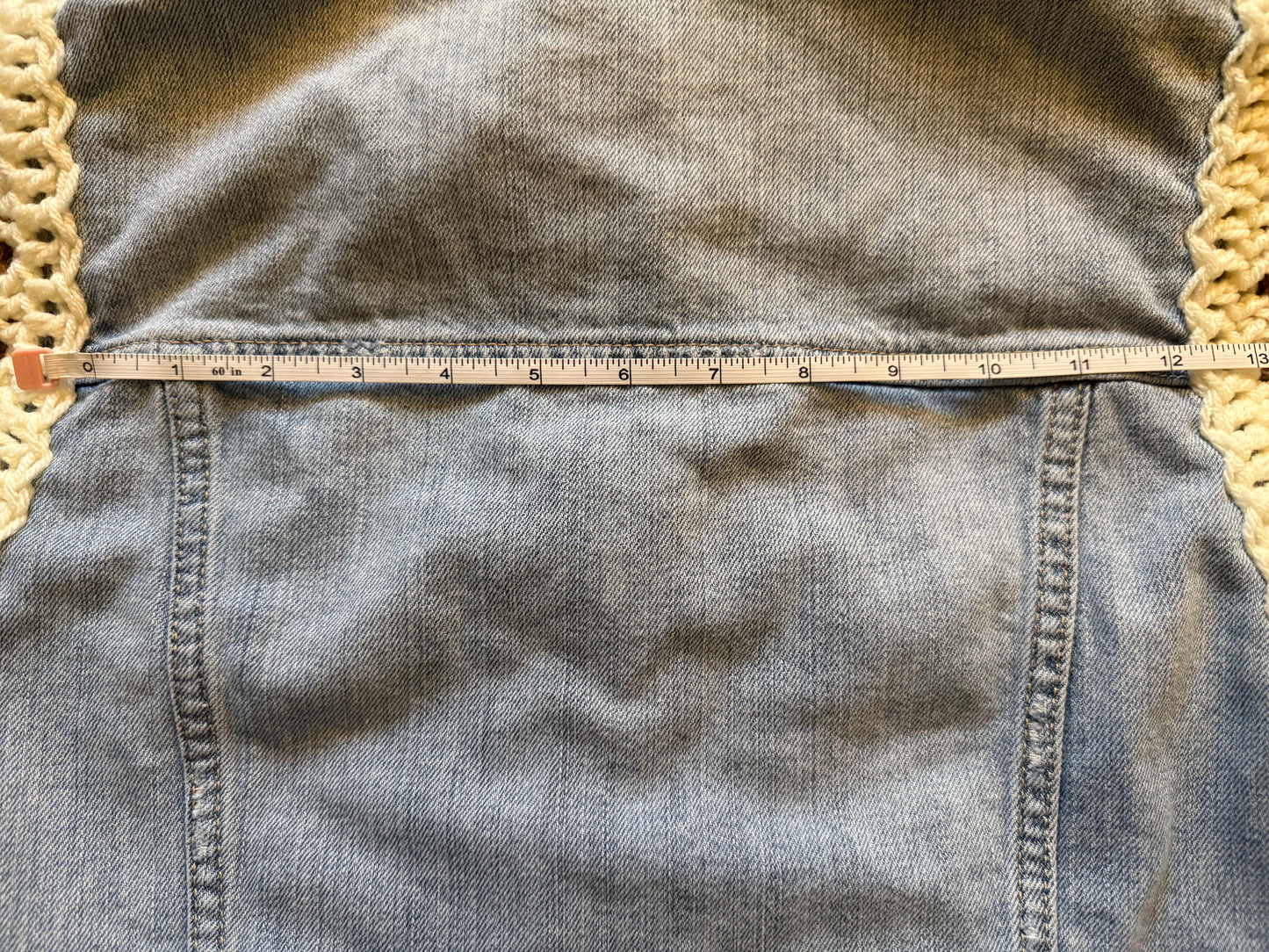 Upcycled denim jacket with crochet sleeves