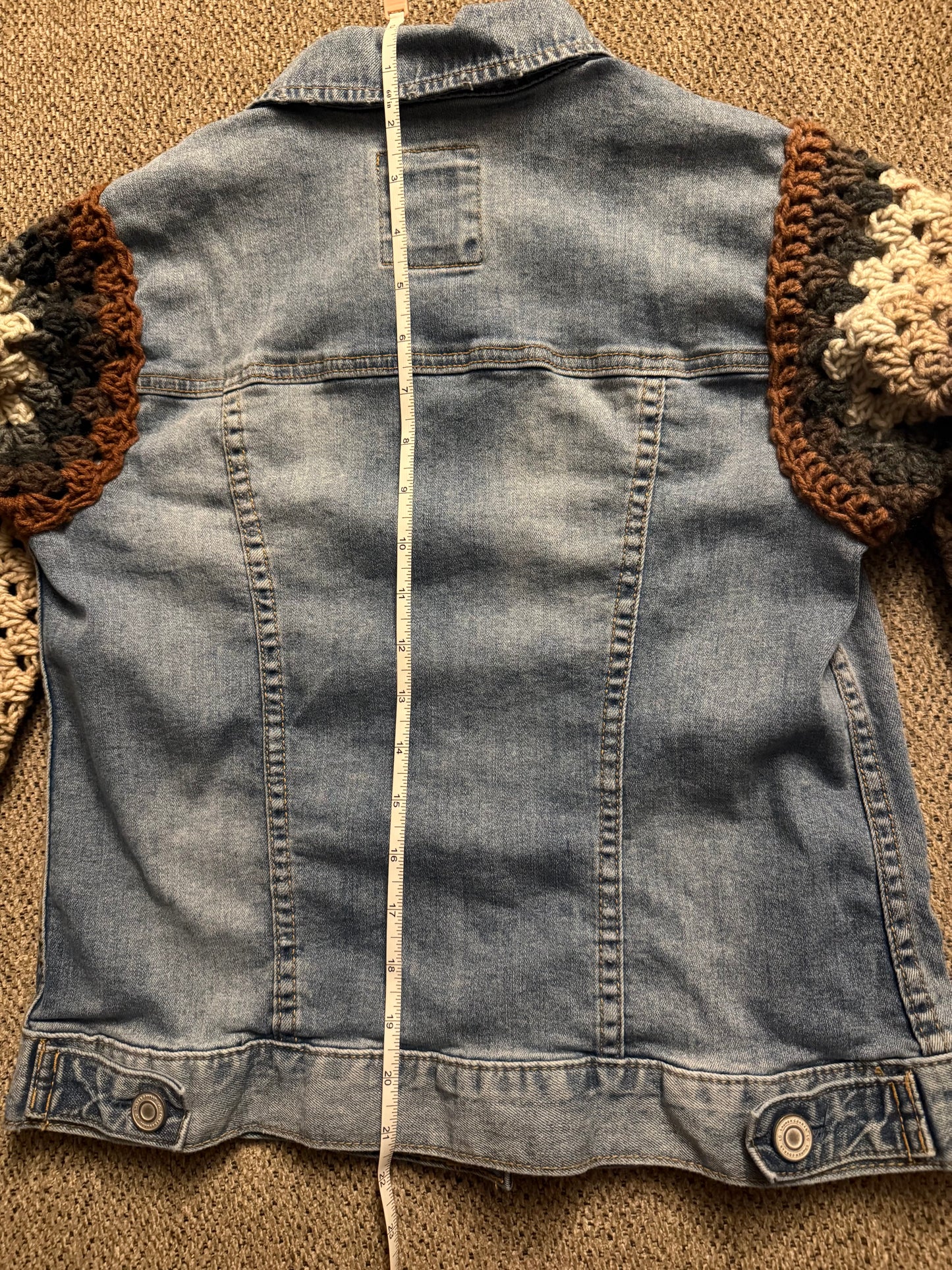 Upcycled denim jacket with crochet sleeves