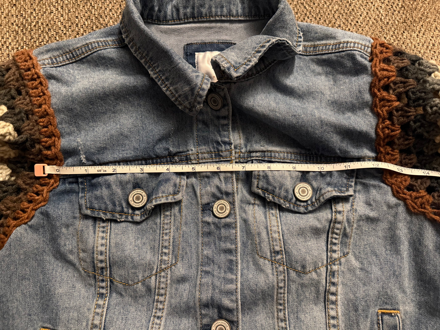 Upcycled denim jacket with crochet sleeves