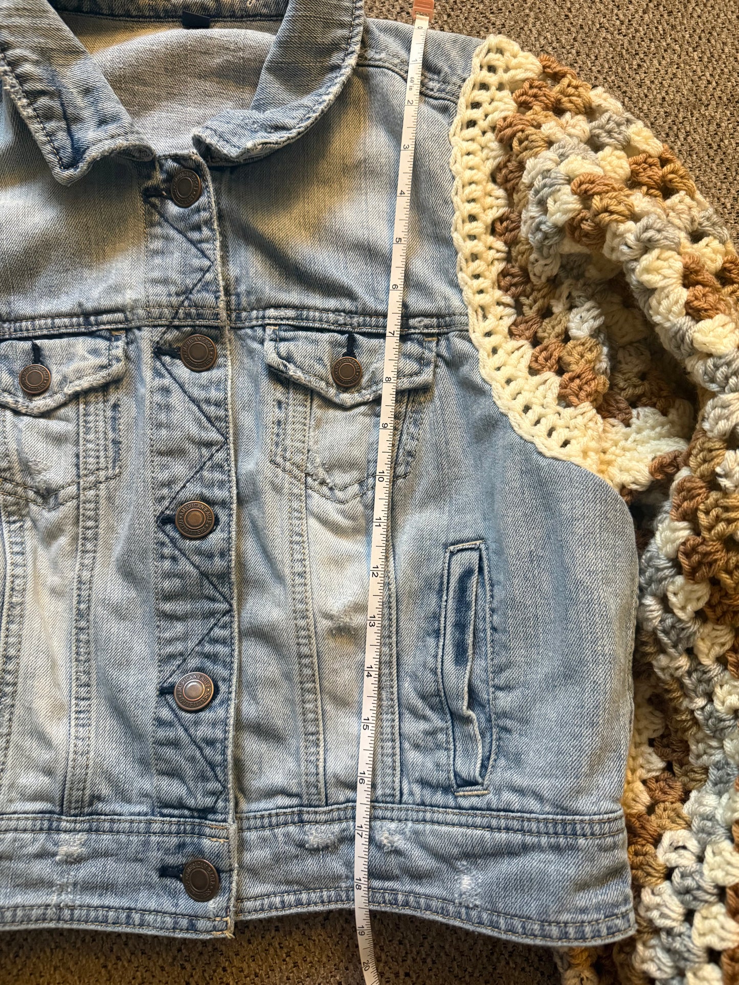 Upcycled denim jacket with crochet sleeves