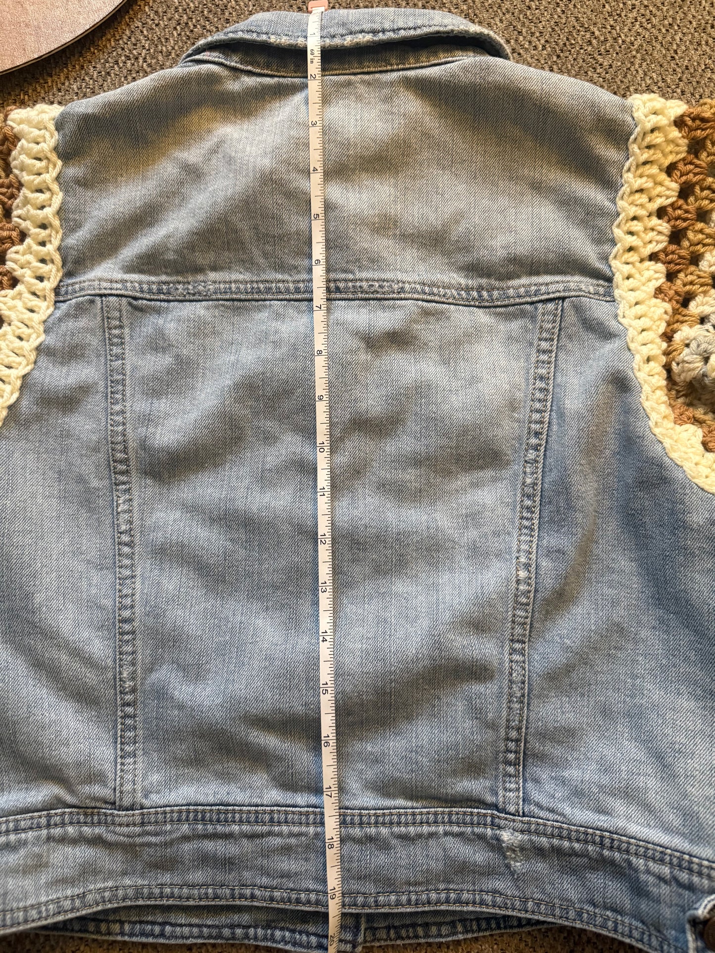 Upcycled denim jacket with crochet sleeves