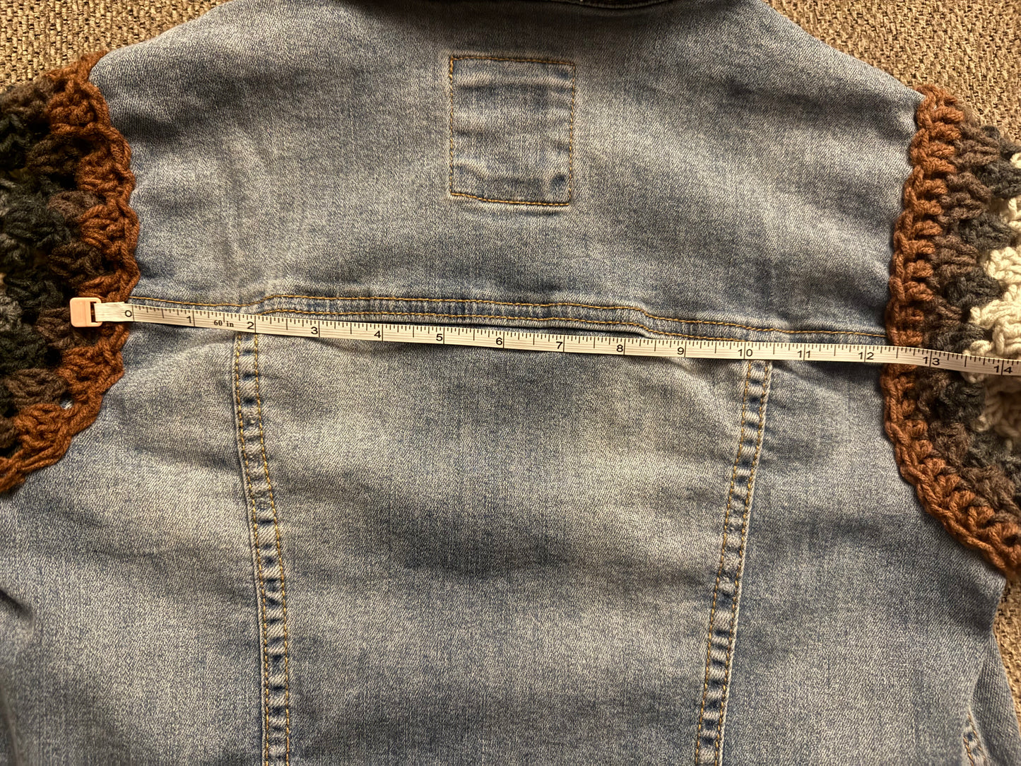 Upcycled denim jacket with crochet sleeves