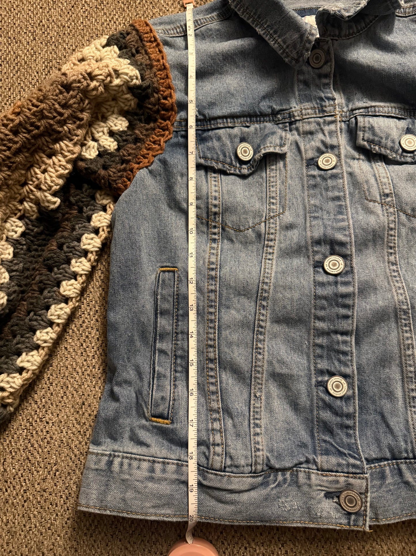 Upcycled denim jacket with crochet sleeves