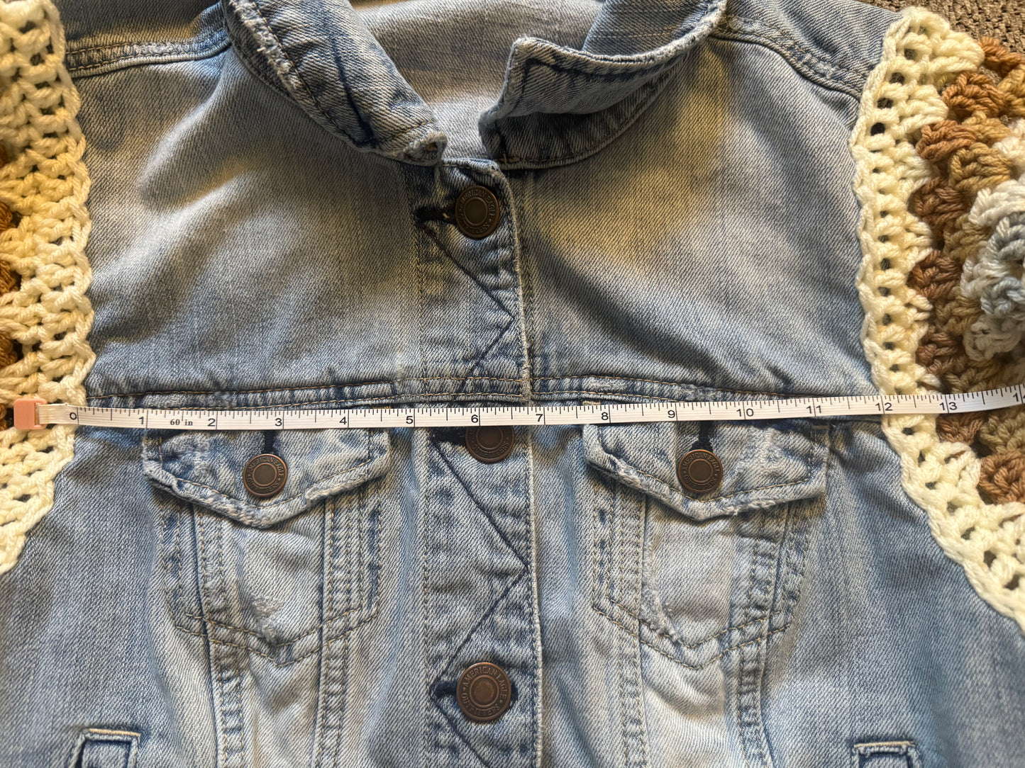 Upcycled denim jacket with crochet sleeves